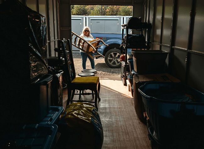 Gravenhurst Calloway Storage Self Storage. Lady placing items in her container in Spring