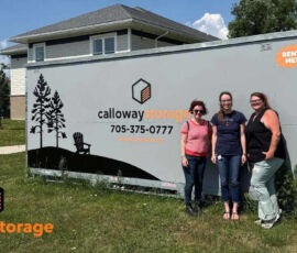 Calloway staff in front of portable storage container with Lighthouse staff